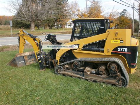 caterpillar skid steer backhoe|caterpillar skid loader attachments.